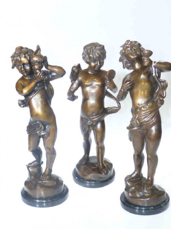 Three bronze models of putti holding conche shell, mirror and wine vessel on marble bases