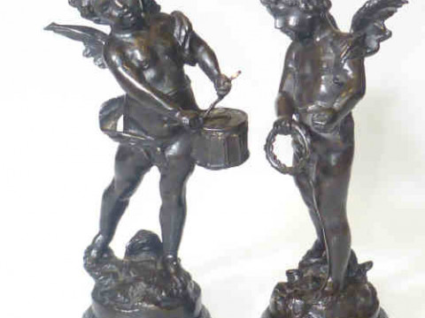 Pair of bronze musical putti playing drum and tambourine, on naturalised...