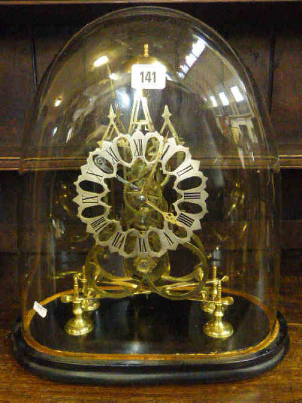 Victorian brass skeleton clock with silvered dial, fusee movement under glass dome