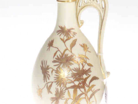 Royal Worcester jug with pierced handle decorated with foliate design...