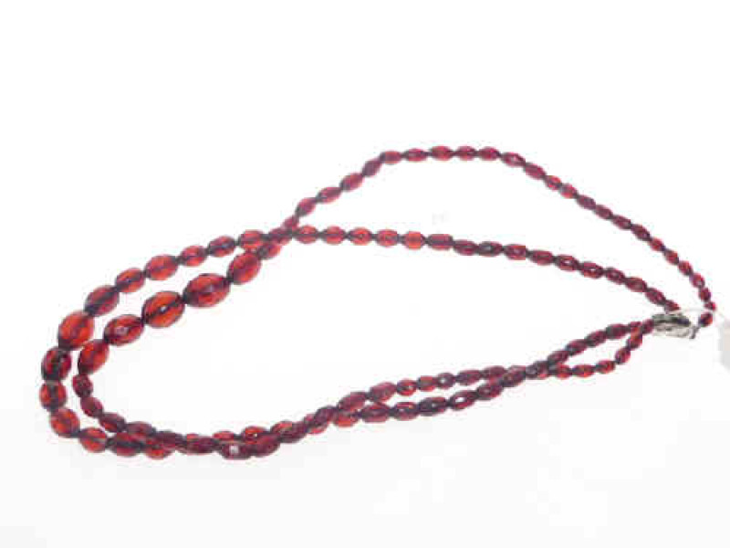Two-strand cherry coloured amber necklace with silver and marcasite clasp, gross 46 grams