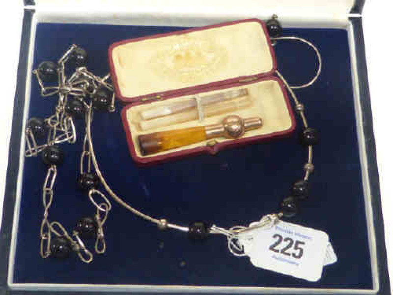 Suite of modernist silver jewellery and a cigarette holder