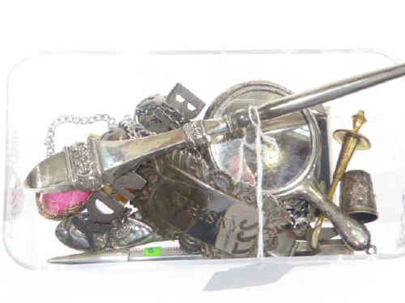 Miniature silver hand mirror, silver-handled button hook, silver gin label, etc