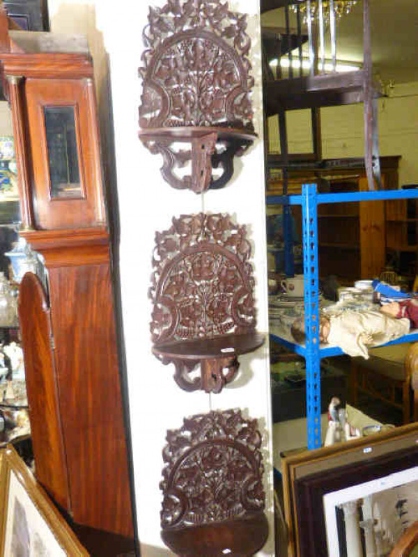 Set of three Anglo-Indian pierced and carved hardwood wall brackets
