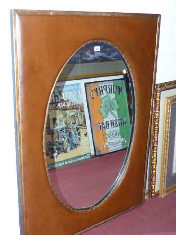 Contemporary leather mounted mirror with oval plate
