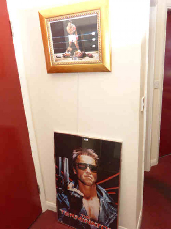 Limited edition boxing print, Mohammed Ali, signed and numbered 31/100, framed; and a framed Terminator poster (2)