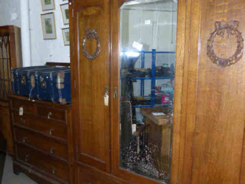 1920's oak mirror door wardrobe and five drawer chest and bed head, two...