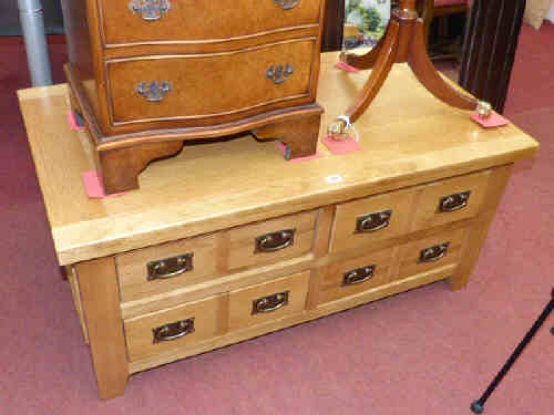 Light oak four drawer low centre table