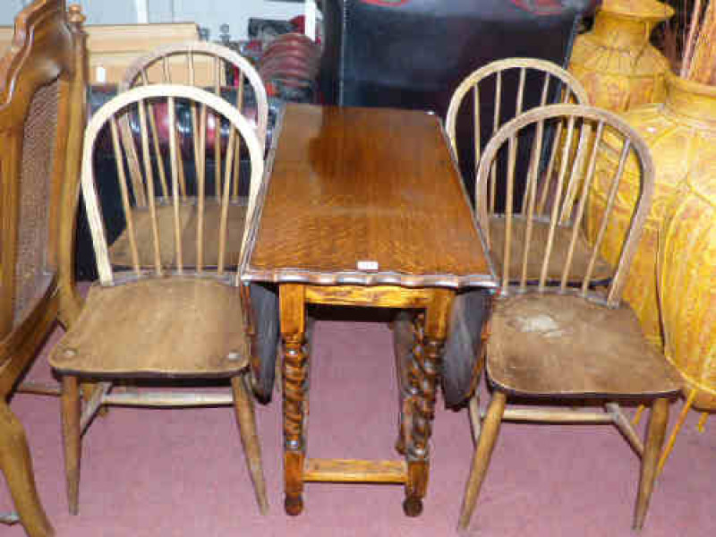 Oak barley twist gate leg dining table and four Windsor style chairs