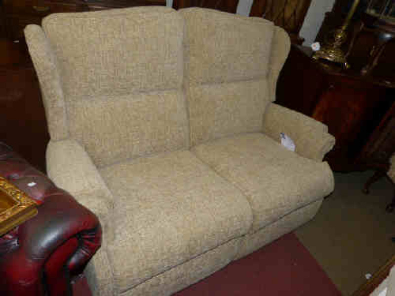Wing two seater settee in beige fabric