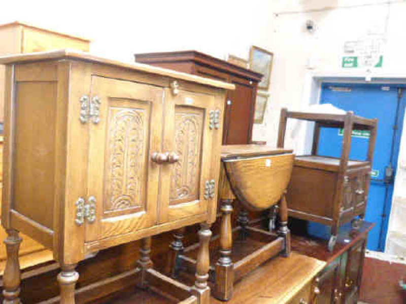 Carved oak two door pedestal cupboard, oak drop leaf coffee table and oak dinner wagon (3)
