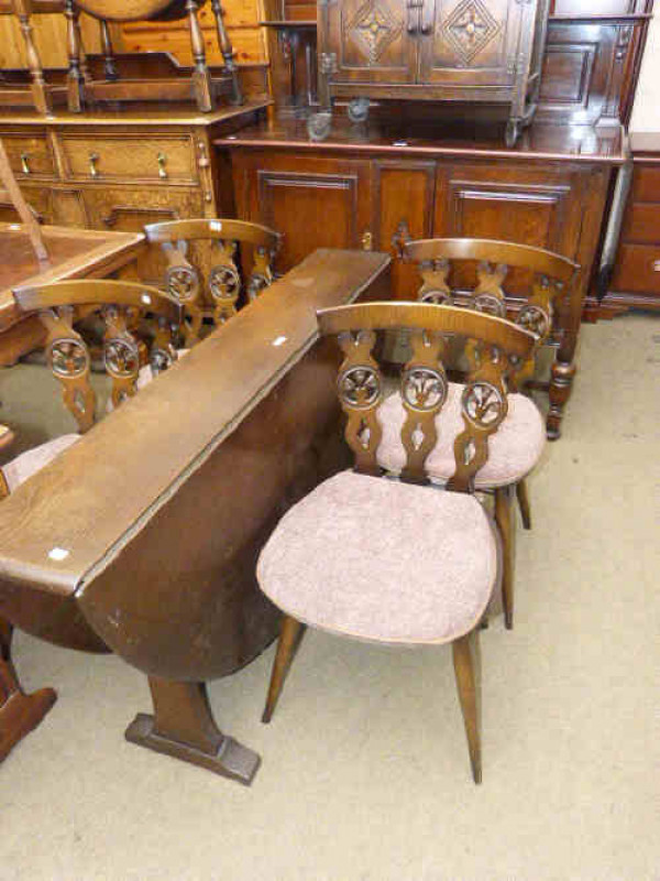 1920's oak two door sideboard, slim Ercol drop leaf dining table and four chairs (6)
