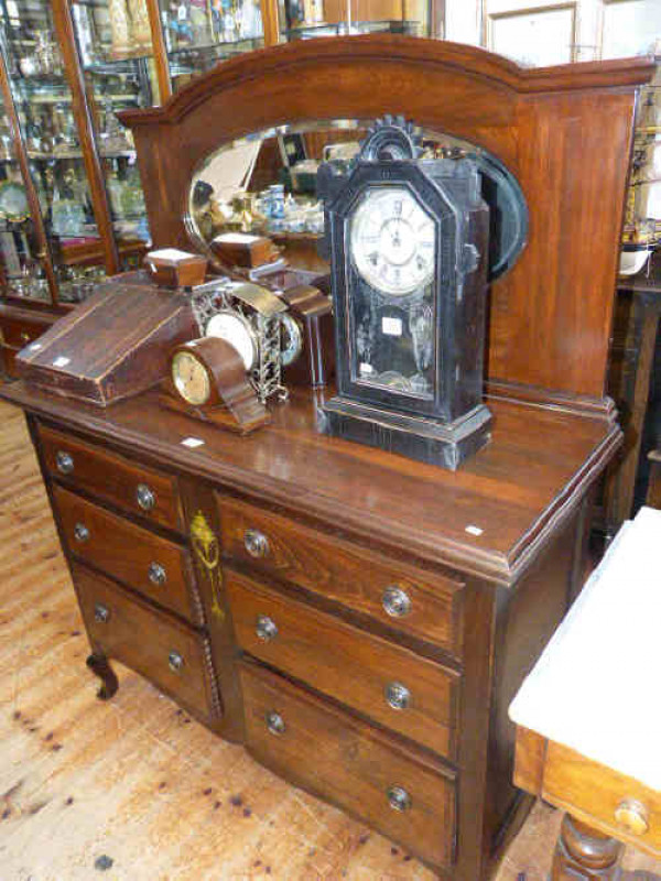 Stained wood mirror back sideboard the base having two banks of three drawers