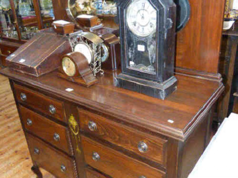 Stained wood mirror back sideboard the base having two banks of three...