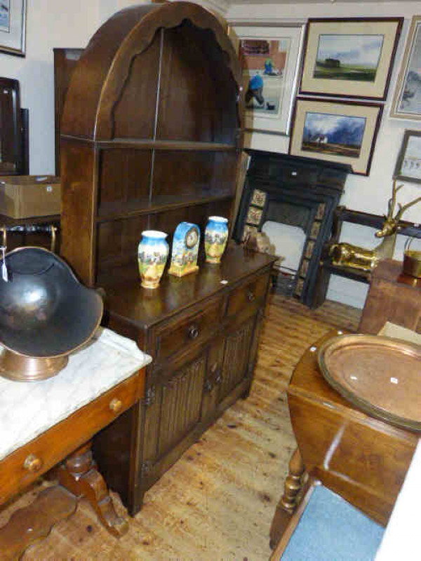 Jaycee oak arch top linen fold dresser, oak turned leg gate leg table and four wavy ladder back oak chairs