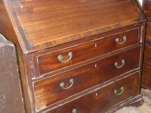 Georgian inlaid mahogany bureau, the fall front above three graduated...