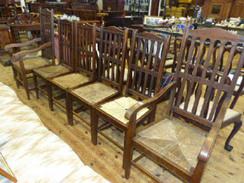 Set of six oak rail back dining chairs with drop in rush seats