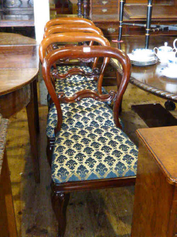 Set of four Victorian mahogany balloon back dining chairs