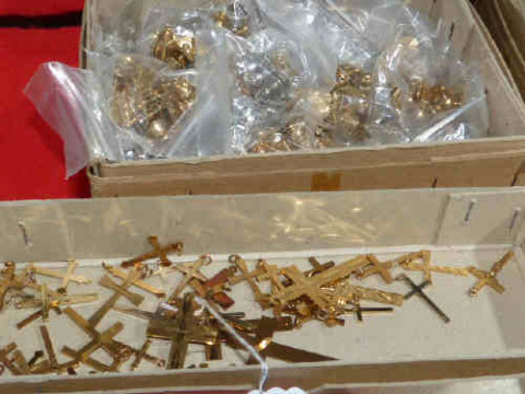 Quantity of gold plated crosses and tie tacs