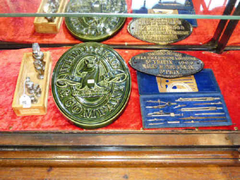 Whitbread advertising plaque, weights, cast iron plaque and drawing instruments