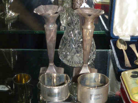 Two silver napkin rings, silver pill box, pair of silver bud vases, etc