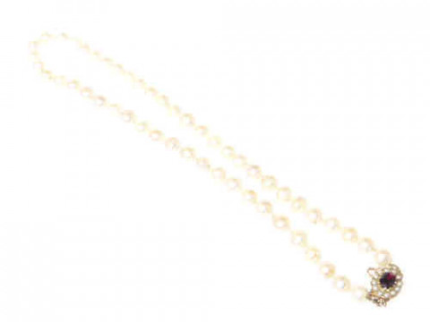 Pearl necklace with garnet and half pearl set oval clasp, gross approximately...