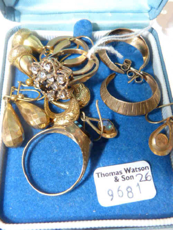 Two 9ct gold rings and five pairs of 9ct gold earrings, approximately 16.8 grams; and a pair of unmarked 'acorn' earrings