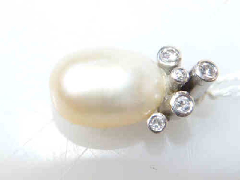 Cultured pearl and diamond pendant