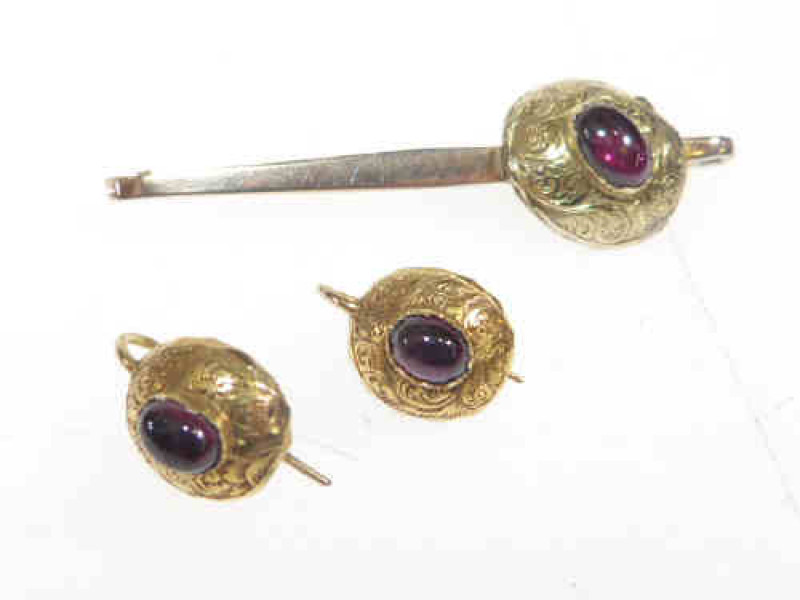 Pair of garnet set earrings and brooch