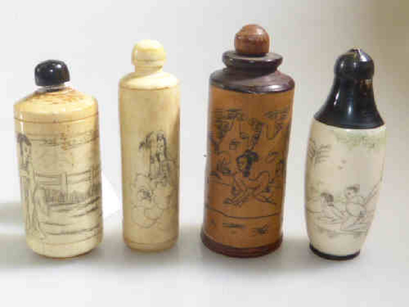 Antique ivory and wood scent bottles, two with erotic decoration