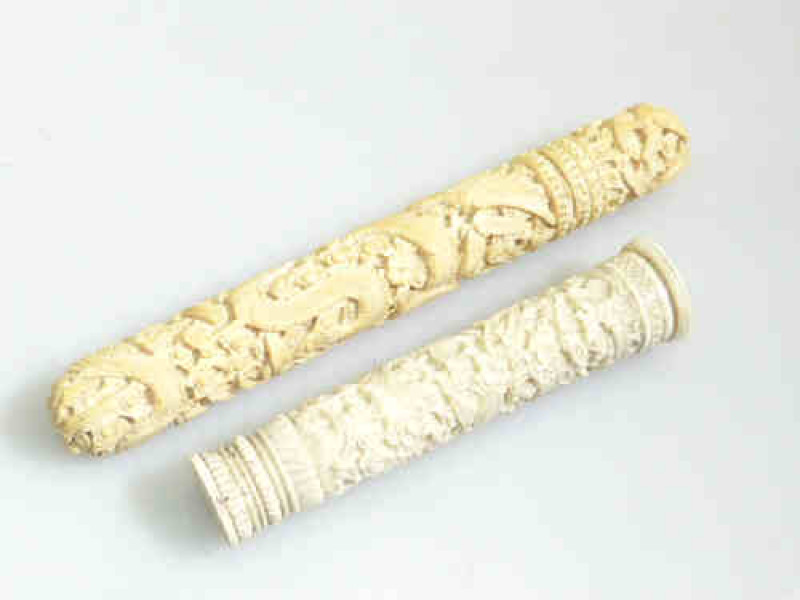 Two intricately carved ivory cylindrical pen/needle holders