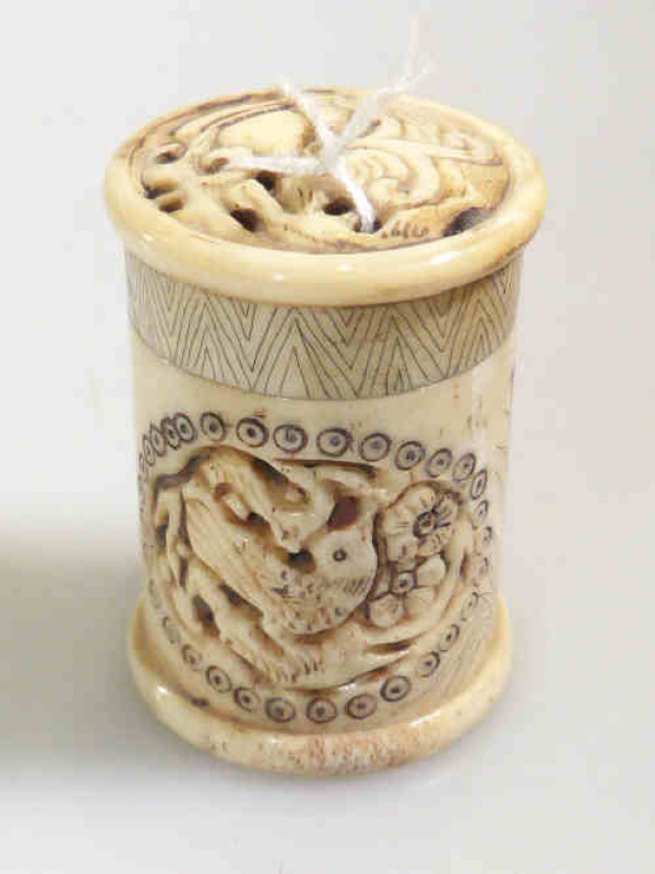 Antique carved ivory cylindrical gaming counter holder, 6cm high