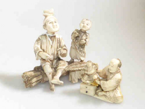 Small ivory signed seated figure and group of old man and child (2)