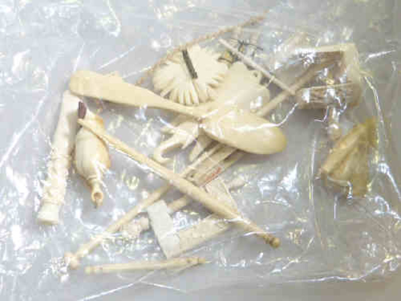Bag of ivory needlework pieces