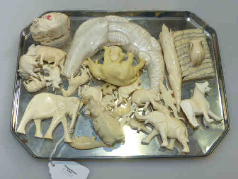Collection of small ivory elephants and animals