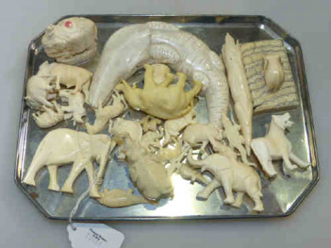 Collection of small ivory elephants and animals