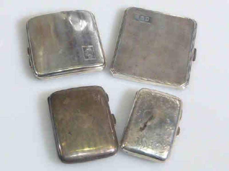 Four silver cigarette cases