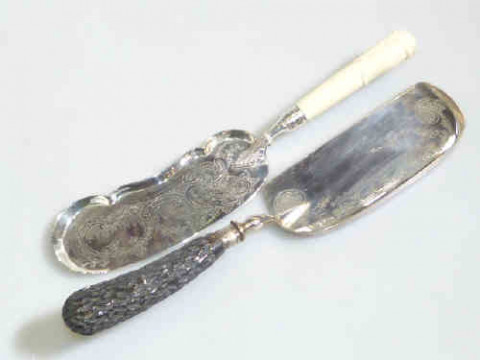 Two silver plated ivory and horn handle crumb trays