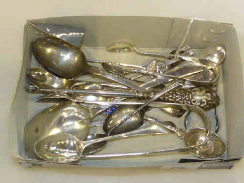 Collection of silver spoons, tongs, butter knife and  button hook