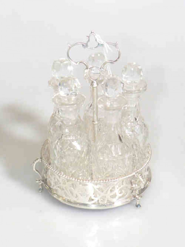 Victorian silver and crystal five bottle cruet