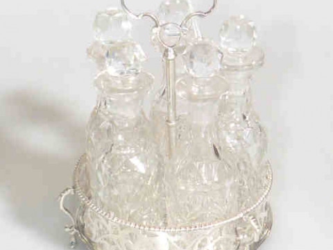 Victorian silver and crystal five bottle cruet