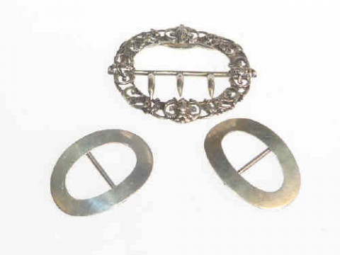 Three silver buckles