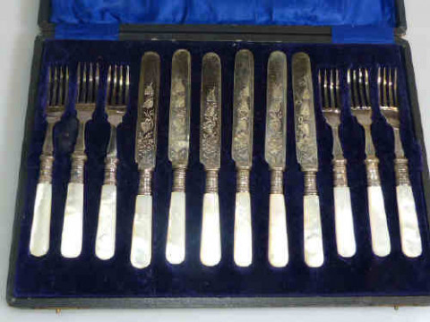 Cased set of six mother of pearl handled dessert knives and forks