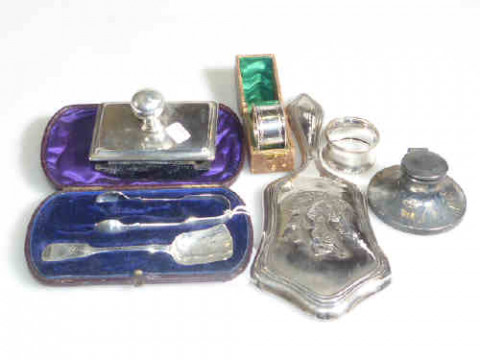 Silver items; blotter, two napkin rings, inkwell, mirror and sugar spoon...