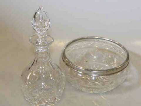 Cut glass decanter and stopper and a glass bowl with silver rim