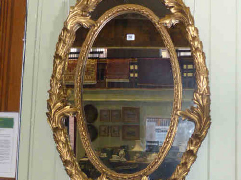 Ornate gilt framed oval wall mirror 130cm x 71cm