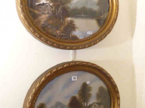 Pair of oval oil paintings of mountainous landscapes in gilt frames
