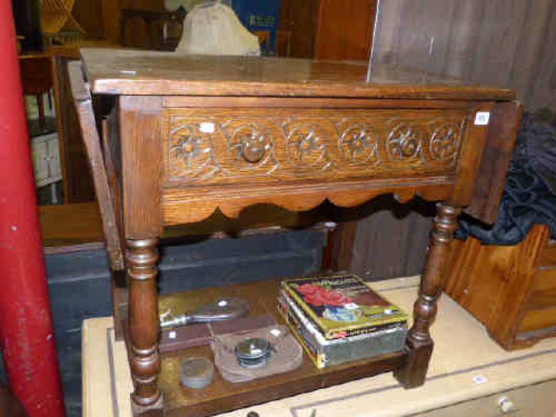 Carved oak drop leaf side table
