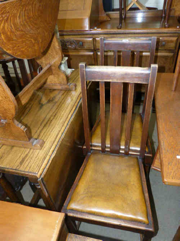 Carved oak sideboard, drop leaf dining table, three chairs and occasional table (6)