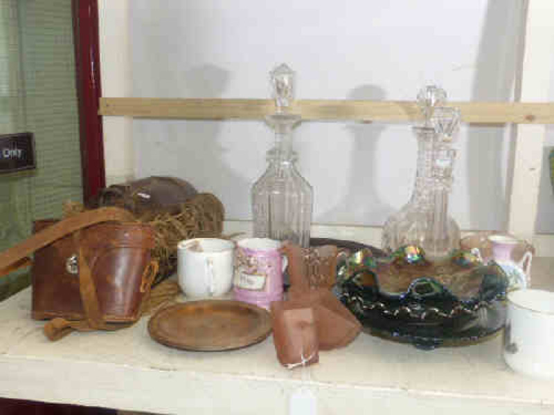 Three ethnic wood masks, three glass decanters, Carnival glass bowls, small pair of binoculars, china, etc